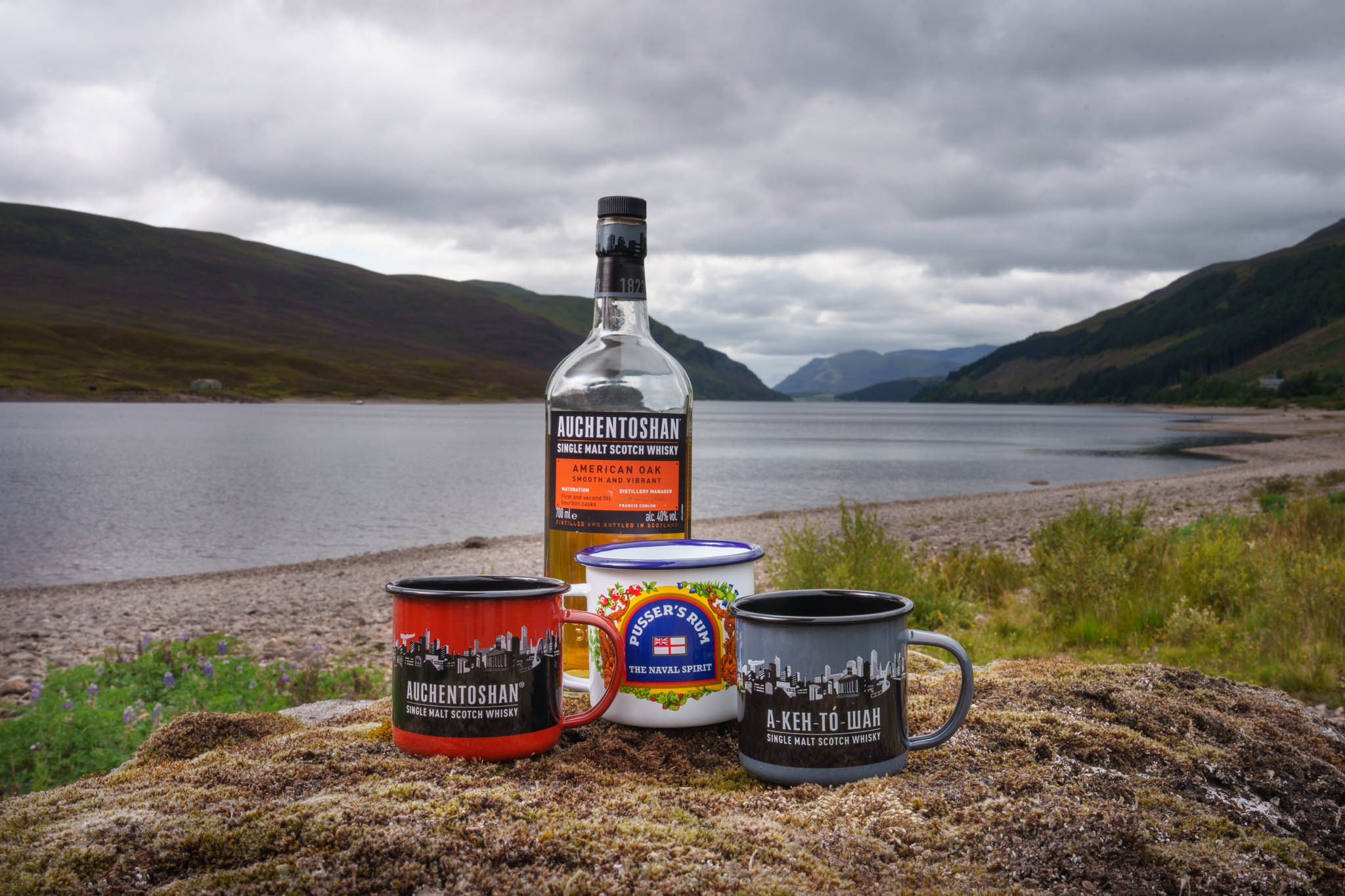 Auchentoshan tin mugs photographed by loch - whisky lifestyle photography Scotland