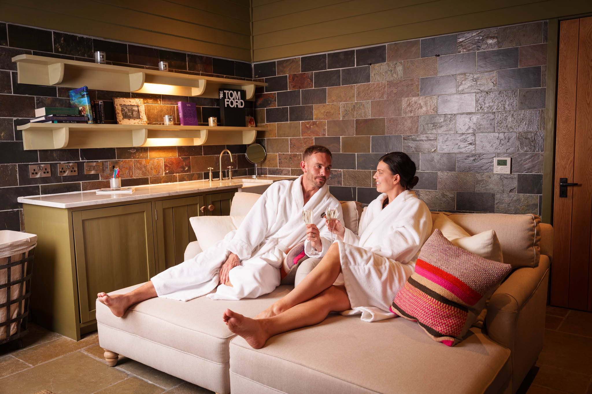 Couple relax after Sauna with fizz